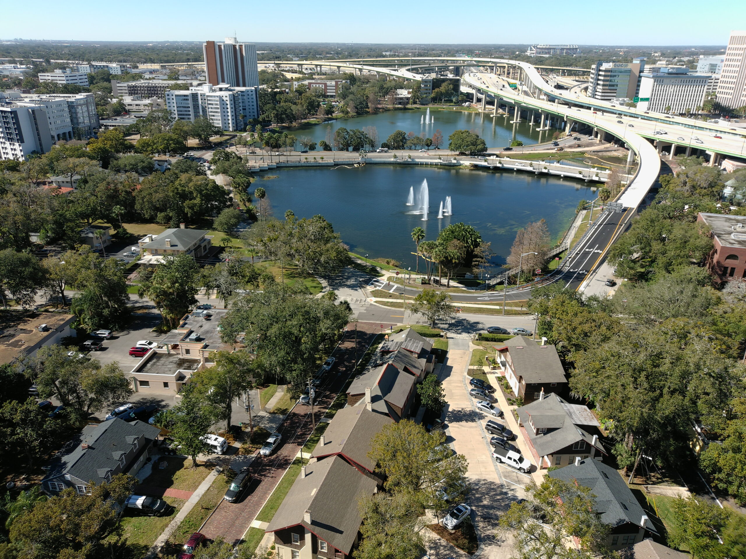 A view of a neighborhood next to a freeway and lakes